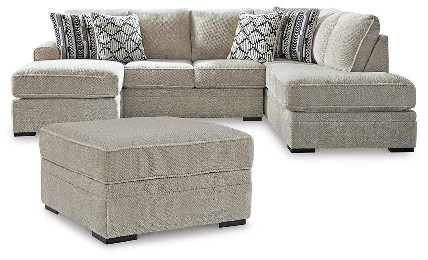 Ashley Furniture Calnita living room set with a sofa and matching chairs, featuring modern design and neutral upholstery.