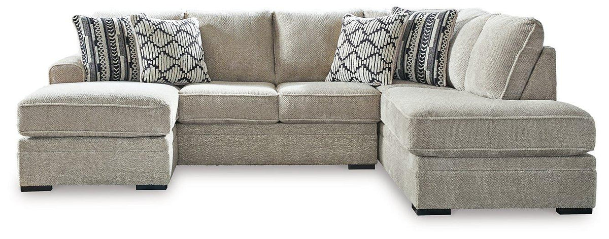Ashley Furniture Calnita living room set featuring a sofa and loveseat with plush cushions and stylish fabric upholstery.