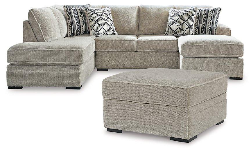 Ashley Furniture Calnita living room set featuring a sofa and loveseat with plush upholstery and modern design.