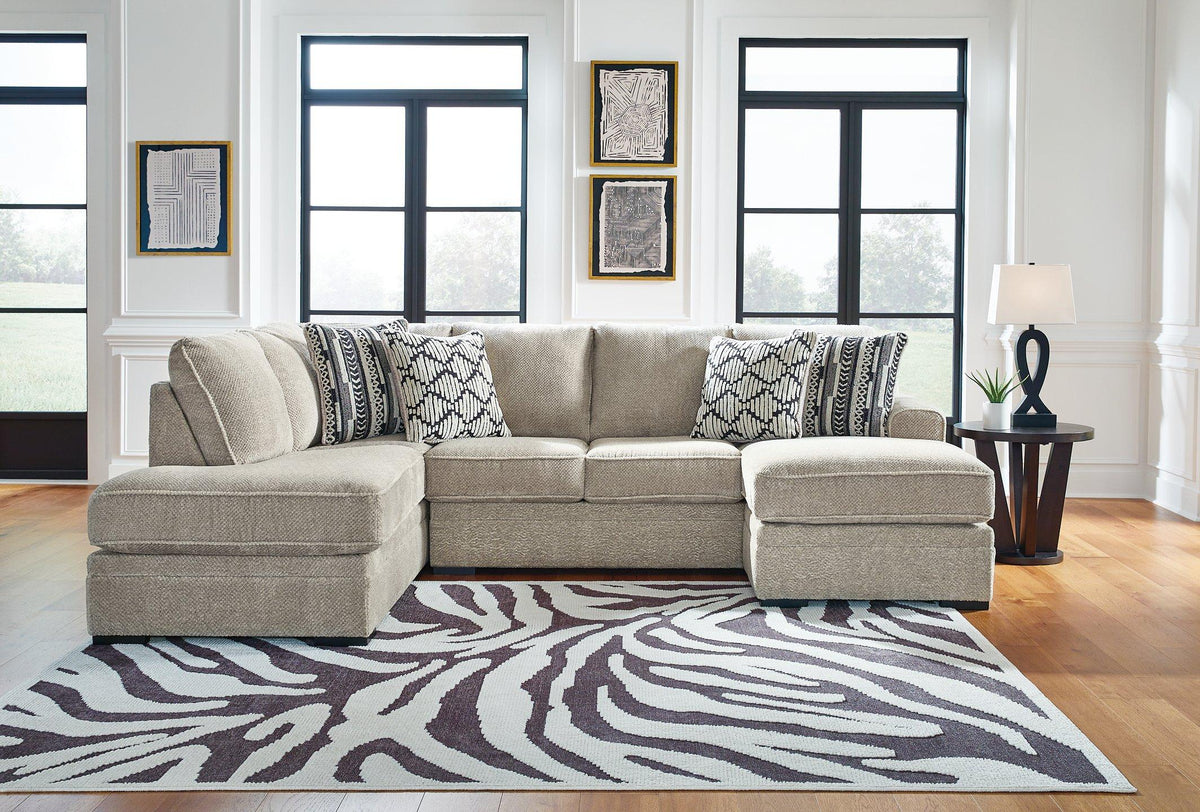 Ashley Furniture Calnita living room set featuring a sofa, loveseat, and coffee table in a modern living room setting