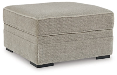 Ashley Furniture Calnita living room set with sofa and armchair, featuring neutral upholstery and modern design.