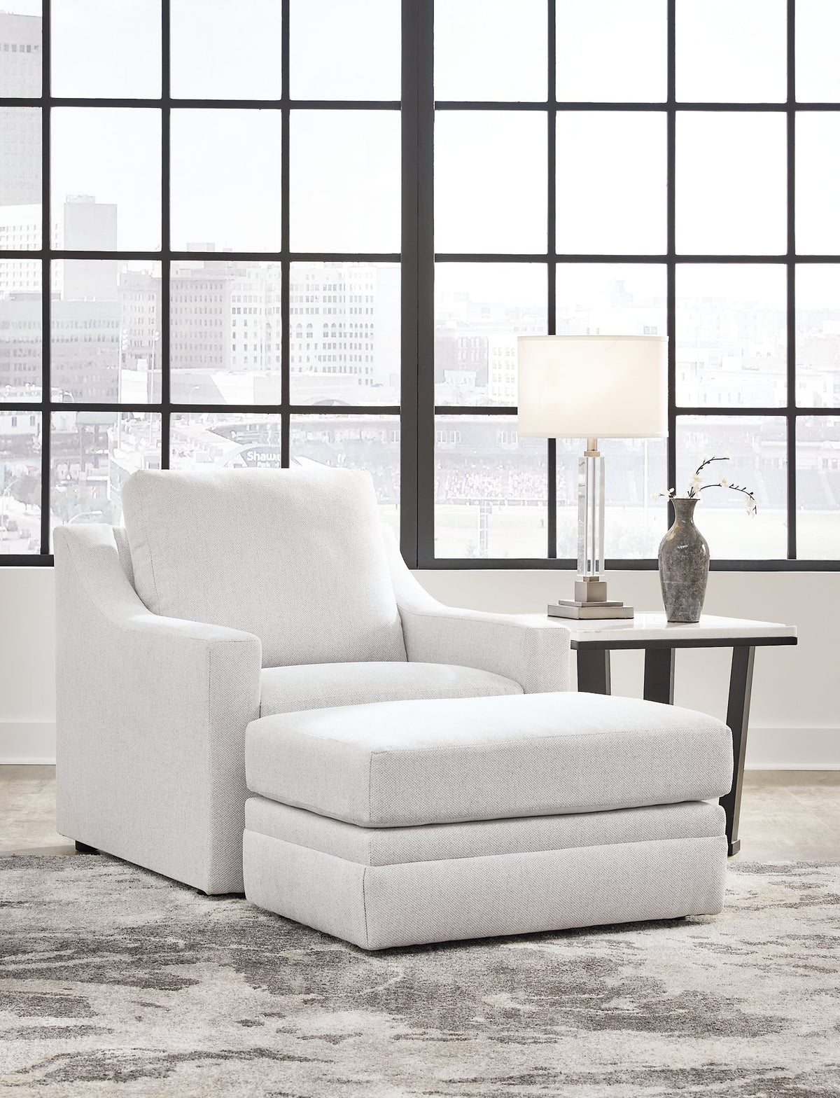Ashley Furniture Maitelynn upholstery living room set featuring a plush sofa and matching armchair in a modern design.