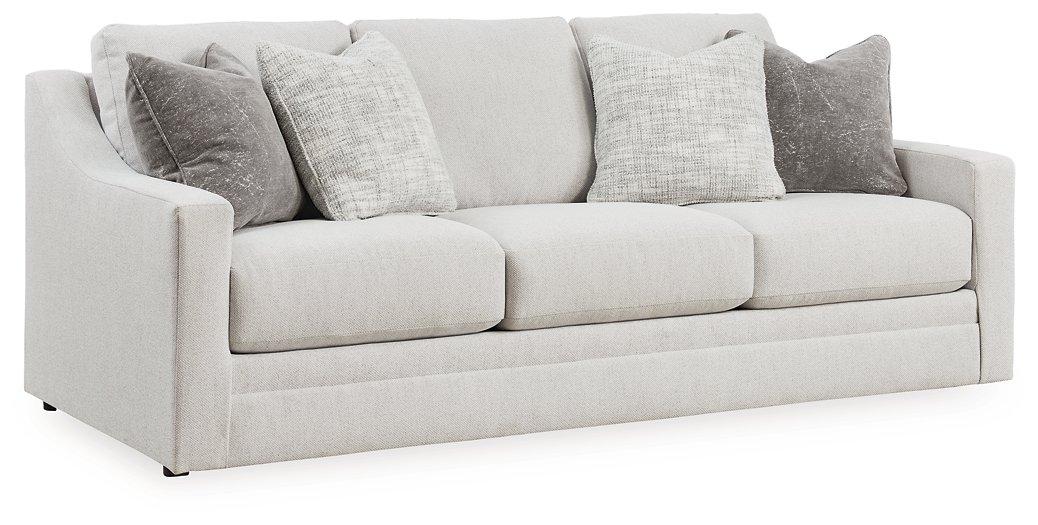 Ashley Furniture Maitelynn upholstery living room set with sofa and armchairs in a modern design, featuring light fabric and stylish cushions.