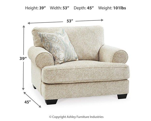 Ashley Furniture Monaghan Living Room Set featuring a sofa and matching armchair with neutral upholstery and contemporary design.