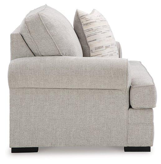 Ashley Furniture Eastonbridge living room set with sofa and loveseat in a modern design, featuring neutral upholstery and wooden legs.