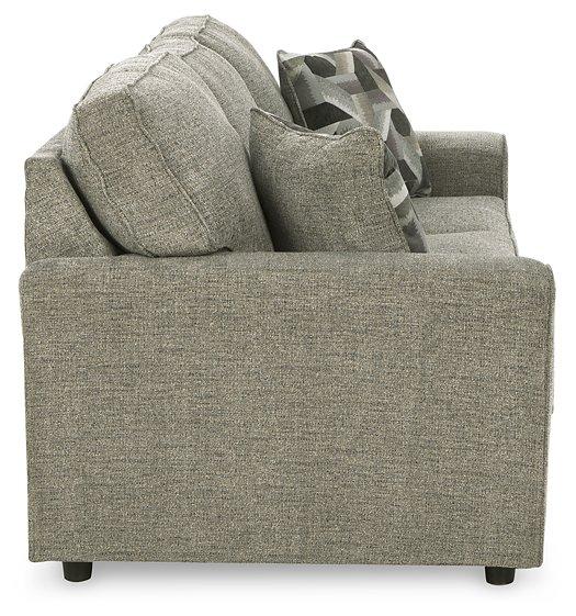 Ashley Furniture Cascilla living room set with a sofa and armchair in a modern design, featuring neutral upholstery.