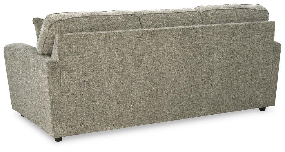 Ashley Cascilla Living Room Set featuring a modern sofa, armchair, and coffee table in a stylish living space.