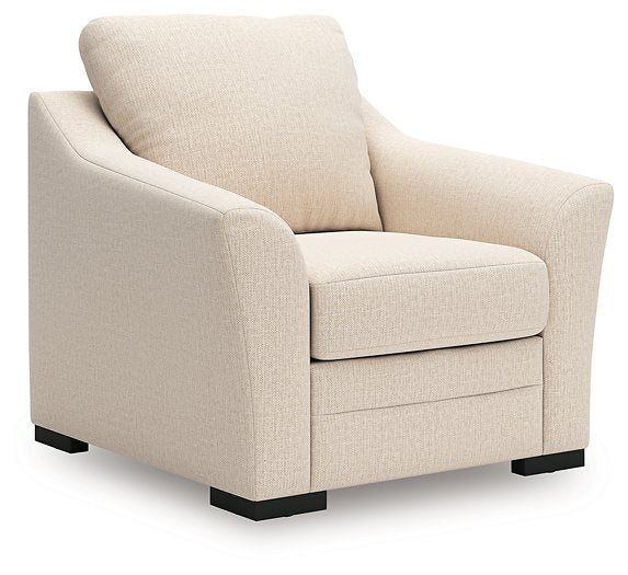 Ashley Furniture Lango living room set with sofa and loveseat, featuring modern upholstery and sleek design.