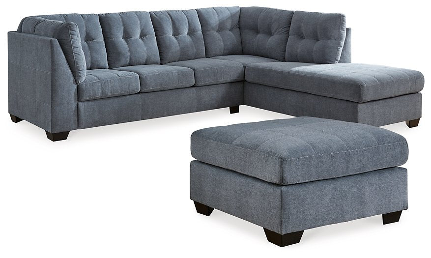 Ashley Furniture Marleton living room set with sofa and loveseat in neutral upholstery, displayed in a modern living space.