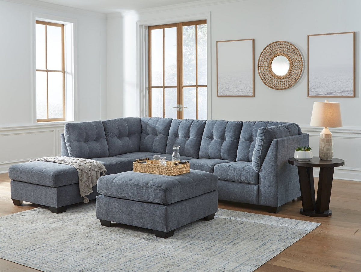 Ashley Furniture Marleton living room set with sofa and armchair, featuring neutral upholstery and modern design.