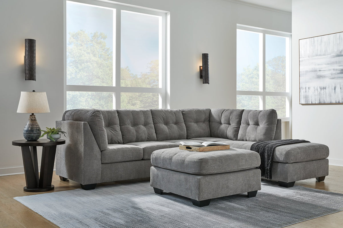 Ashley Furniture Marleton living room set with sofa and armchair in a modern design, featuring neutral fabric and stylish cushions.
