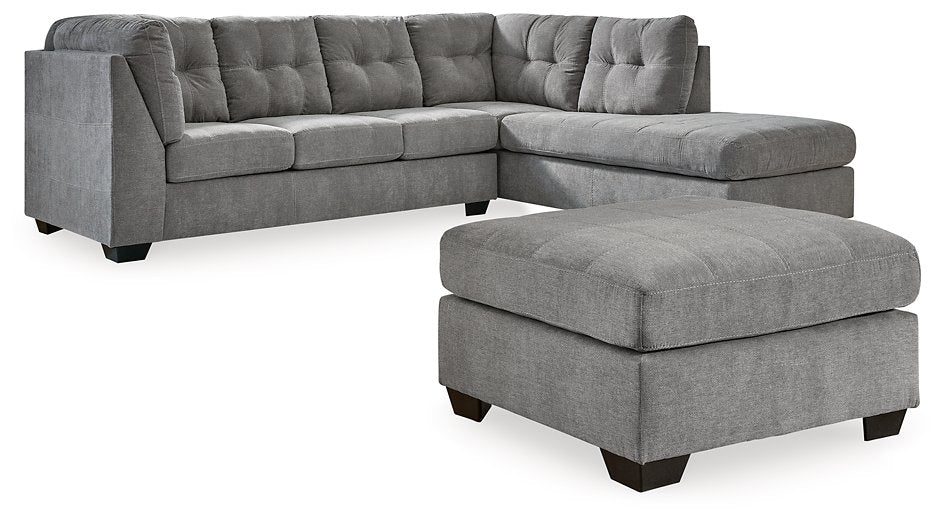 Ashley Furniture Marleton living room set featuring a sofa and armchair with neutral fabric upholstery and modern design.