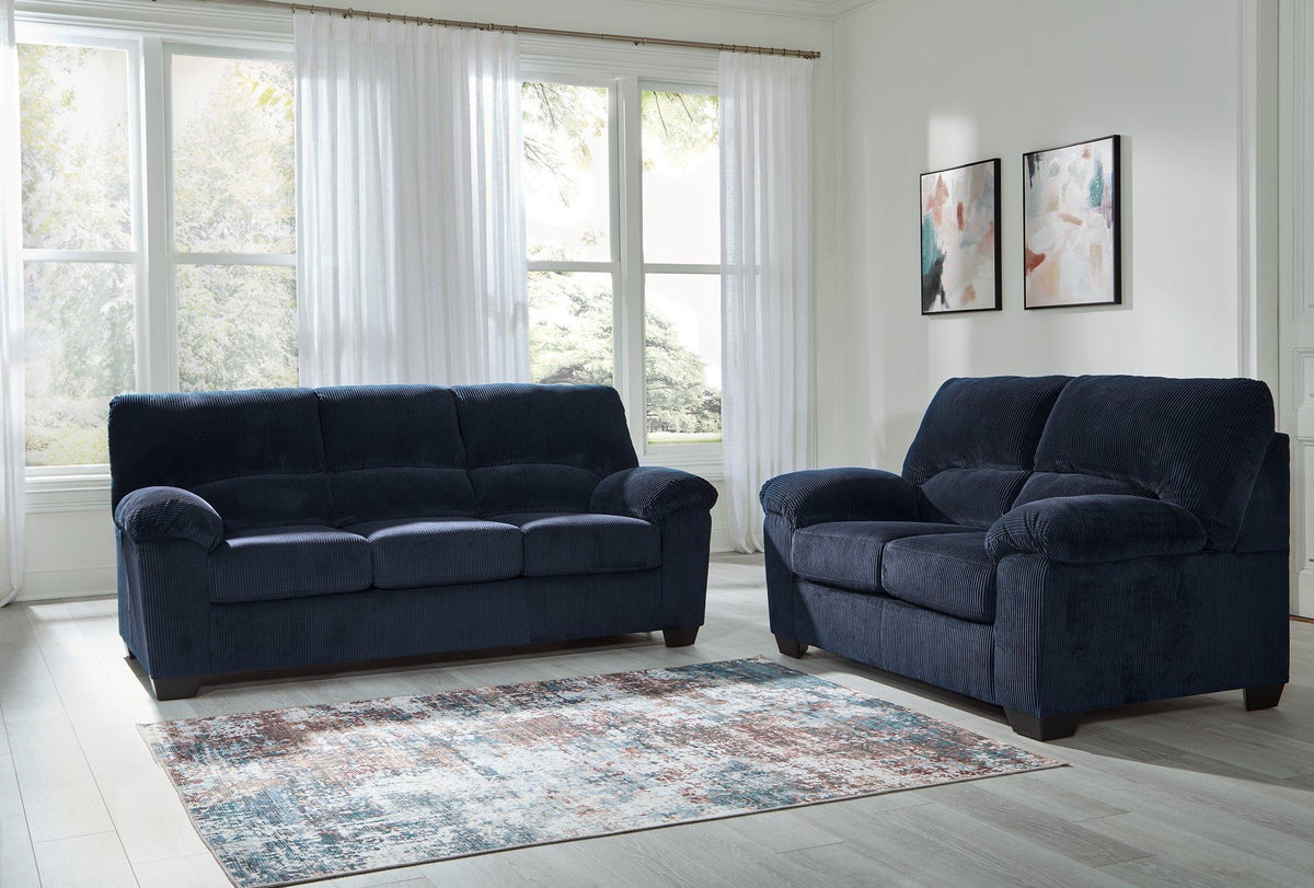 Ashley Furniture SimpleJoy living room set with sofa and loveseat in a modern design, featuring neutral upholstery and plush cushions.