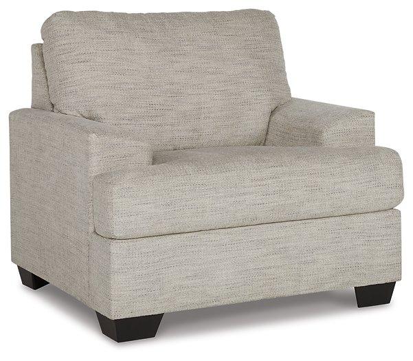 Ashley Furniture Vayda Living Room Set featuring a sofa and armchairs with neutral upholstery and modern design.