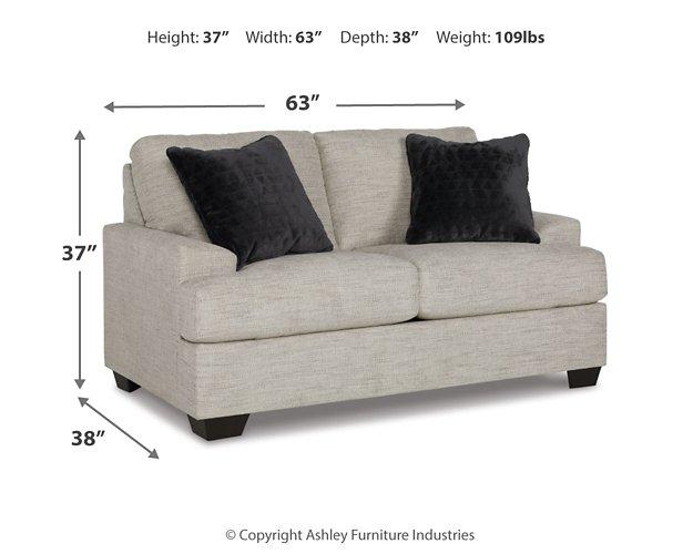 Ashley Furniture Vayda living room set featuring a sofa and armchair in a modern living space with neutral upholstery and stylish design.
