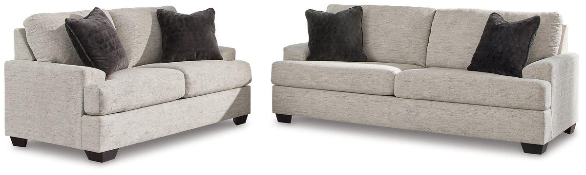 Ashley Furniture Vayda living room set with sofa and armchair, featuring neutral upholstery and modern design.