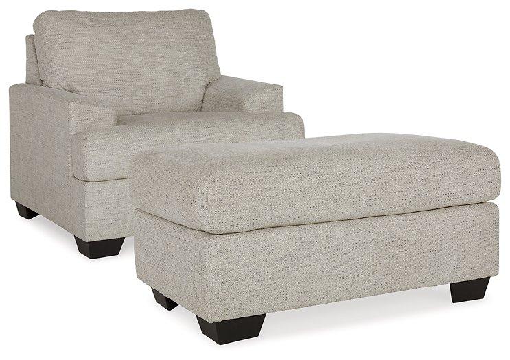 Ashley Furniture Vayda living room set featuring a sofa and loveseat with neutral upholstery and modern design.