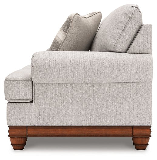 Ashley Furniture Clearbrooke living room set with beige fabric sofa and matching armchair, stylish and comfortable for modern living rooms.
