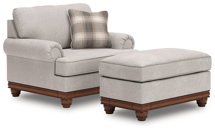 Ashley Furniture Clearbrooke living room set featuring a sofa, loveseat, and armchair with neutral fabric and wooden accents.