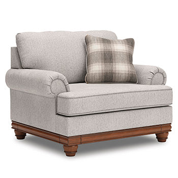 Ashley Furniture Clearbrooke living room set with sectional sofa and matching ottoman, featuring neutral fabric and plush cushions.