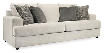 Ashley Furniture Soletren Living Room Set with sofa and armchair in a modern living space featuring neutral upholstery and wooden accents.