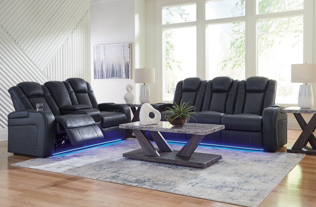 Ashley Furniture Fyne-Dyme living room set with sofa, loveseat, and armchair in a modern fabric, arranged in a cozy living space.