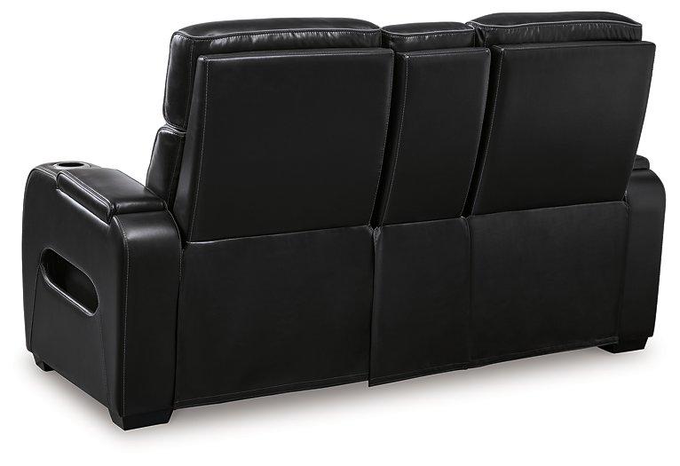 Ashley Boyington Power Reclining Loveseat with Console, featuring plush upholstery, built-in cup holders, and reclining seats.