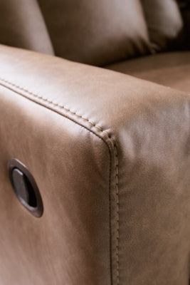 Ashley Furniture Mackmenville reclining loveseat with console, featuring plush cushions and jumbo stitch detailing.