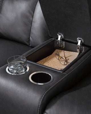 Ashley Furniture Mackmenville reclining loveseat with console, featuring plush fabric and armrest storage, ideal for living room seating.