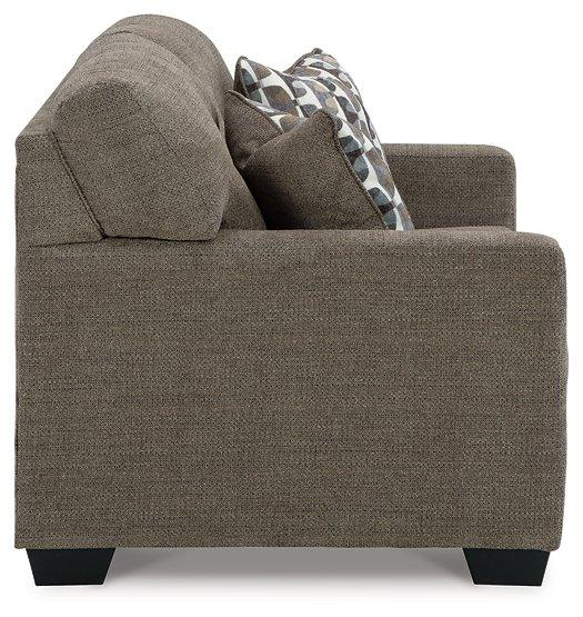 Ashley Mahoney loveseat with plush fabric and cushioned arms, perfect for cozy living room seating.