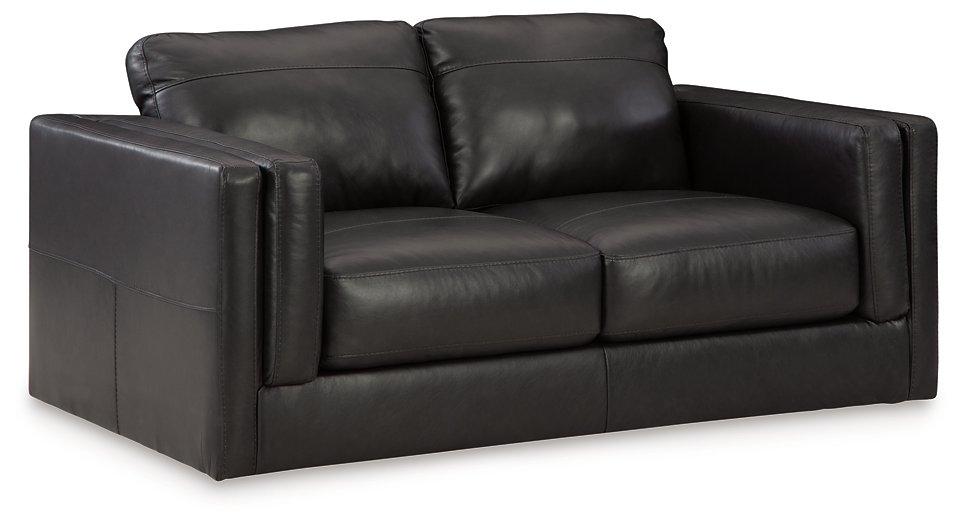 Ashley Furniture Amiata loveseat with plush fabric and cushioned armrests, ideal for cozy living room seating.