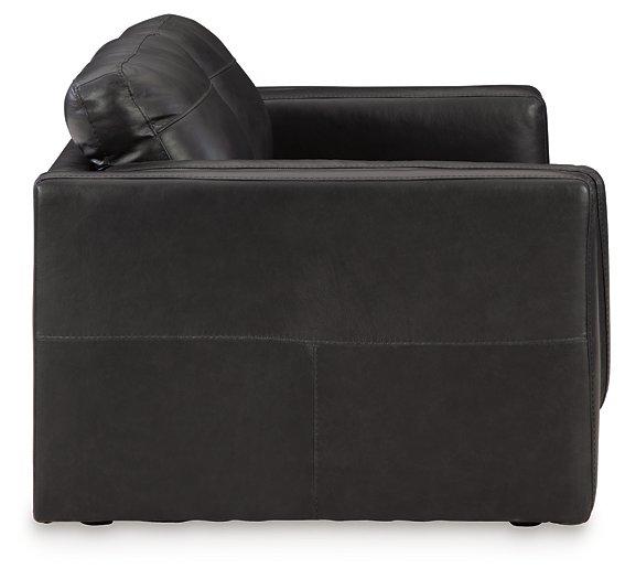 Ashley Furniture Amiata loveseat with plush fabric and cozy cushions, perfect for living room seating.
