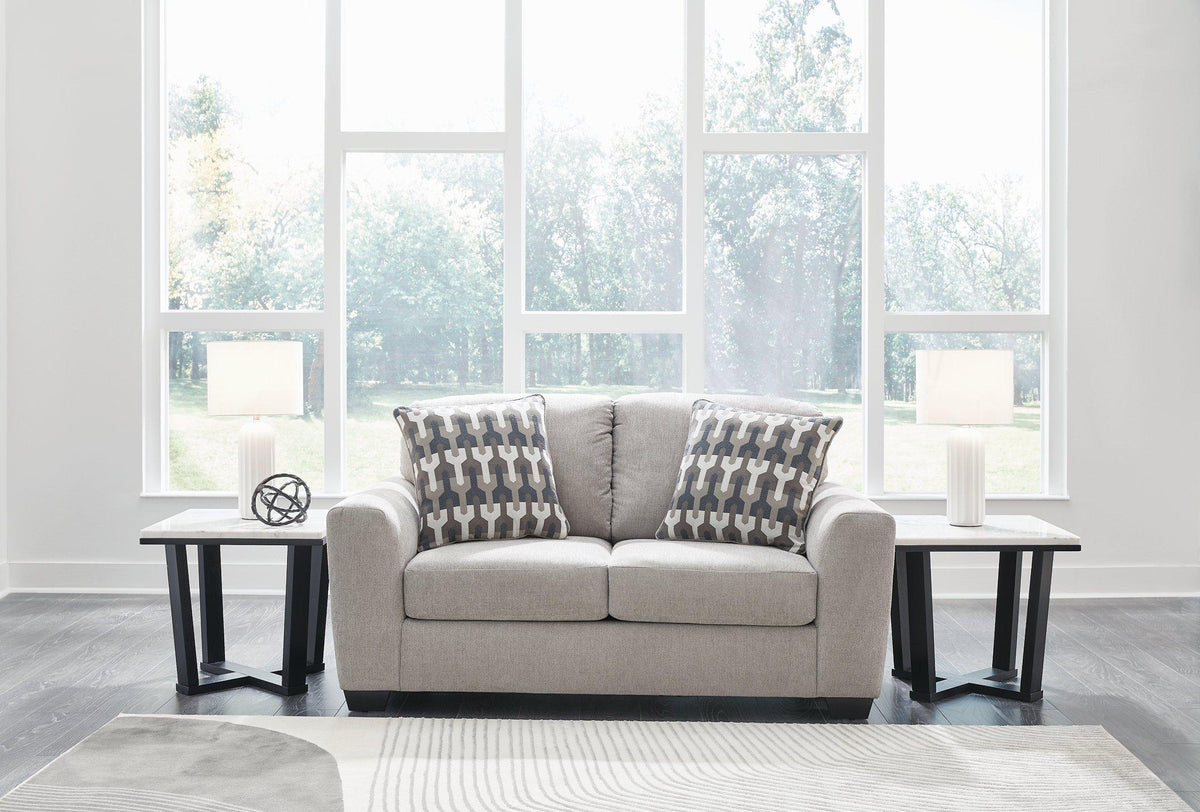 Avenal Park loveseat by Ashley Furniture, plush upholstered seating with cushions and wooden legs in a modern living room setting.
