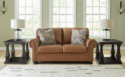 Ashley Furniture Carianna Loveseat with plush fabric upholstery and cushioned armrests, ideal for cozy living room seating.