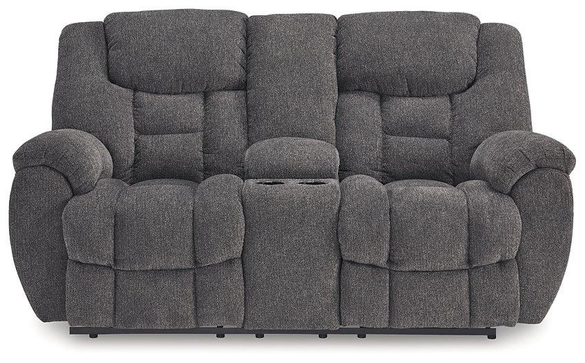 Ashley Furniture reclining loveseat with console, featuring plush cushions, armrests, and built-in cup holders for added comfort.
