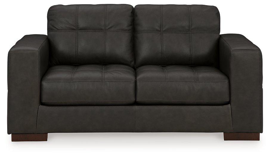 Ashley Furniture Luigi Loveseat with plush fabric, contemporary design, and comfortable cushioning for stylish living room seating.