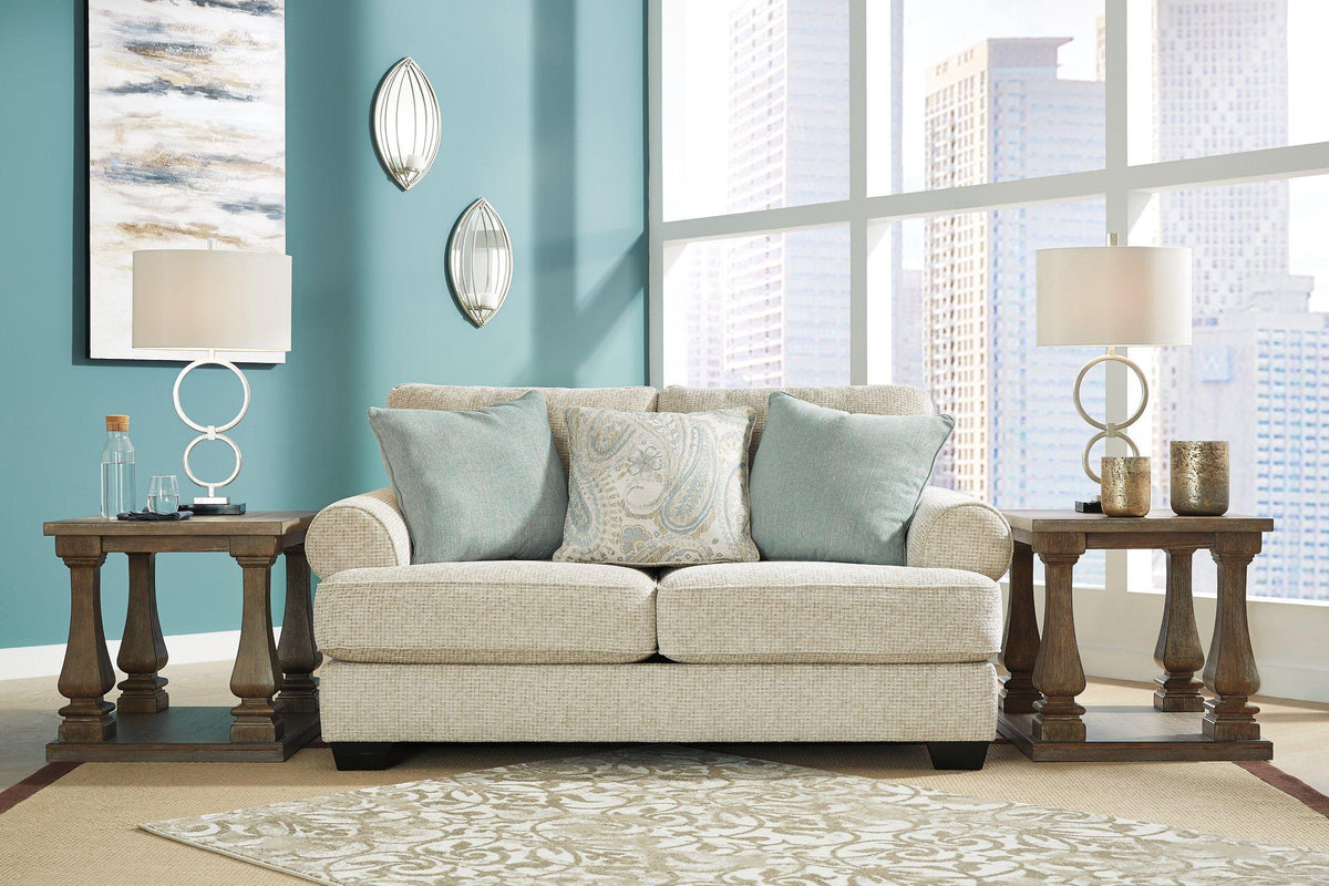 Ashley Furniture Monaghan loveseat with plush fabric upholstery and cushioned armrests, ideal for cozy living room seating.