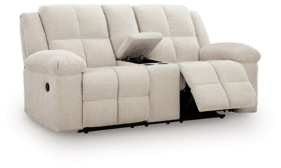 Ashley Furniture Orlen reclining loveseat with console, shown from an open angle highlighting plush fabric and built-in cup holders.