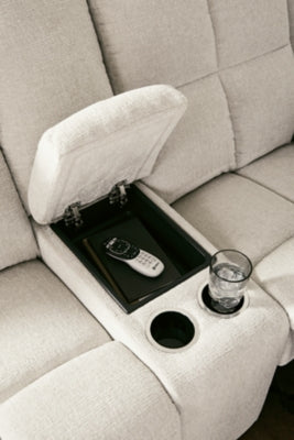 Ashley Furniture Orlen reclining loveseat with console, featuring plush fabric, built-in cup holders, and cushioned armrests.