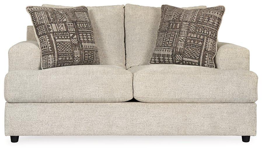 Ashley Furniture Soletren loveseat with plush fabric, featuring a cozy, modern design and cushioned armrests.