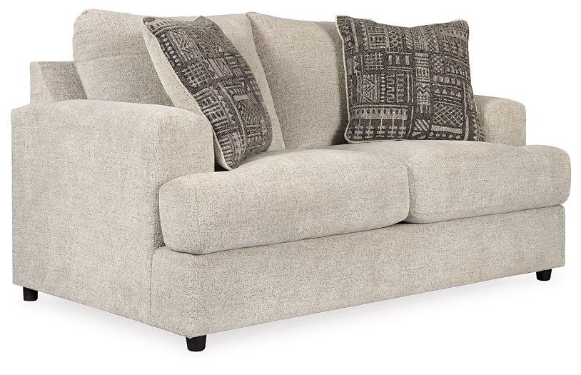 Ashley Furniture Soletren loveseat in beige fabric with plush cushions and modern design, ideal for living room seating.