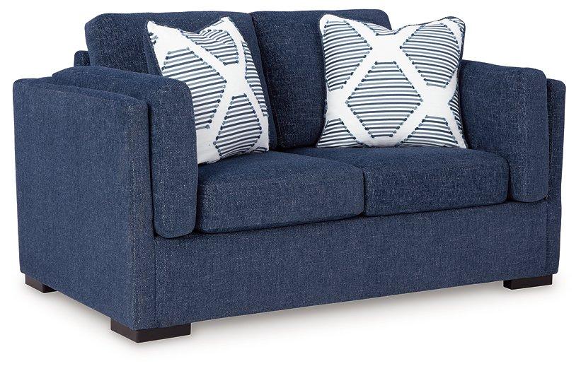 Ashley Furniture Evansley loveseat with plush fabric, cushioned armrests, and a stylish, modern design for comfortable seating.
