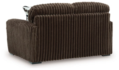 Ashley Furniture Midnight-Madness loveseat with plush upholstery and sleek design, shown from the back view.