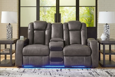 Ashley Furniture Fyne-Dyme Power Reclining Loveseat with Console, showing plush fabric, reclining mechanism, and built-in center console.