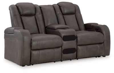 Ashley Furniture Fyne-Dyme power reclining loveseat with center console, featuring plush upholstery and reclining seats in an angled view.