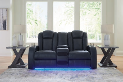 Ashley Furniture Fyne-Dyme Power Reclining Loveseat with Console, featuring plush upholstery and built-in cup holders on the armrest.