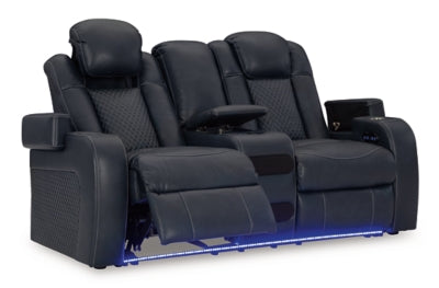 Ashley Furniture Fyne-Dyme power reclining loveseat with console, showing the open reclined position and plush fabric upholstery.
