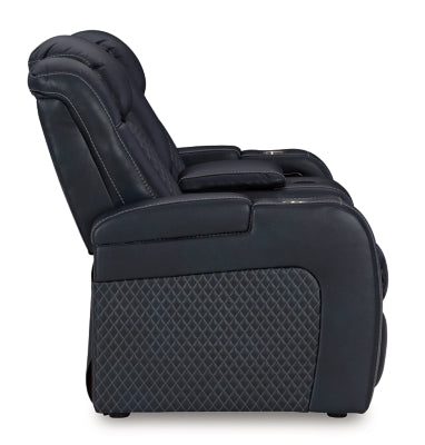 Ashley Furniture Fyne-Dyme power reclining loveseat with console, showing plush fabric, reclining mechanism, and armrests.