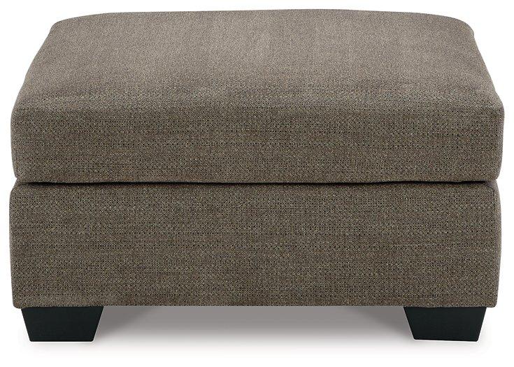 Mahoney oversized accent ottoman by Ashley Furniture with plush fabric, serving as a versatile living room footrest or extra seating.