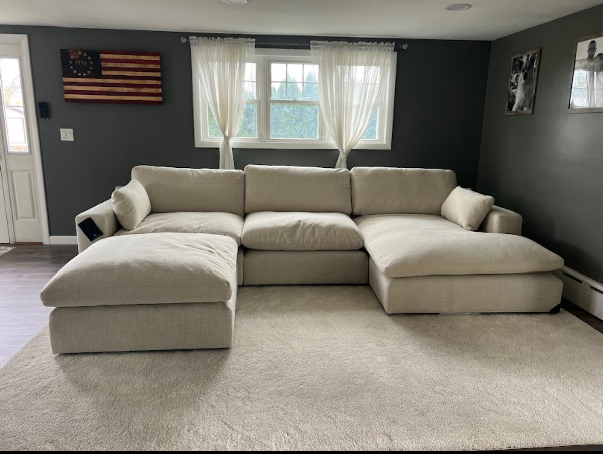 Large Atlas Cloud Oversized Ottoman from Ashley Furniture, soft fabric upholstery and plush cushion for versatile living room decor.